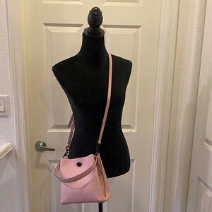 Elegant Bucket Coach Bag on Pink Crossbody Bag